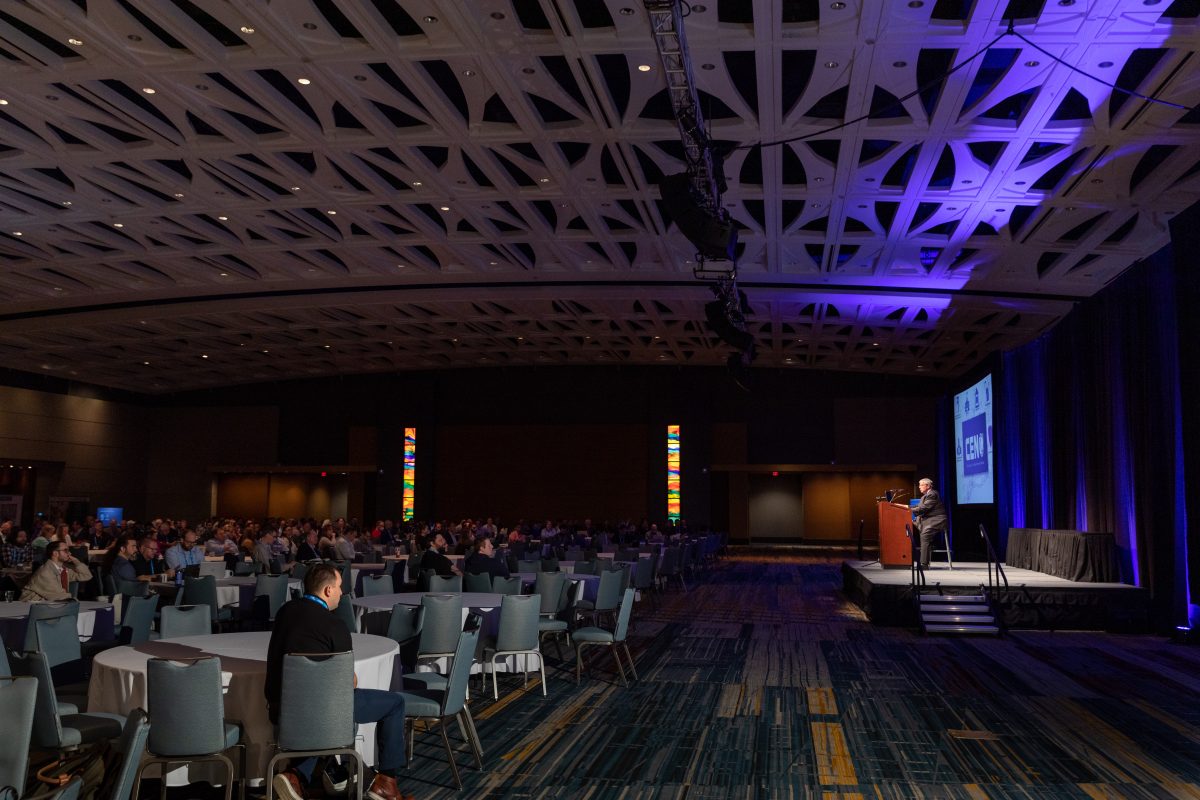 2023 Keynote Speaker on the stage with the audience in their chairs