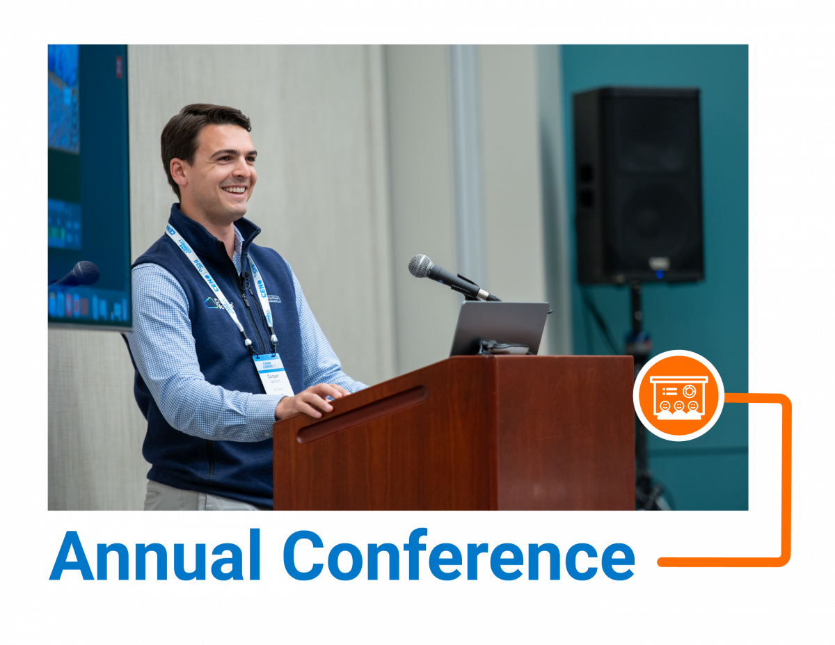 Man smiling at a podium with a microphone and his computer at CEN Connect 2026, with the caption, 'Annual Conference'